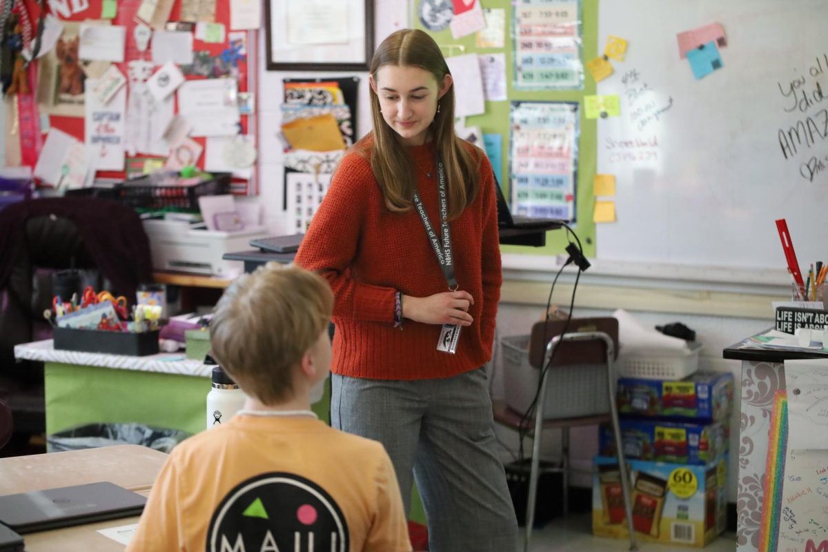 Laurel Seddon (12) walks around the room answering questions about her ocean zones lesson. 